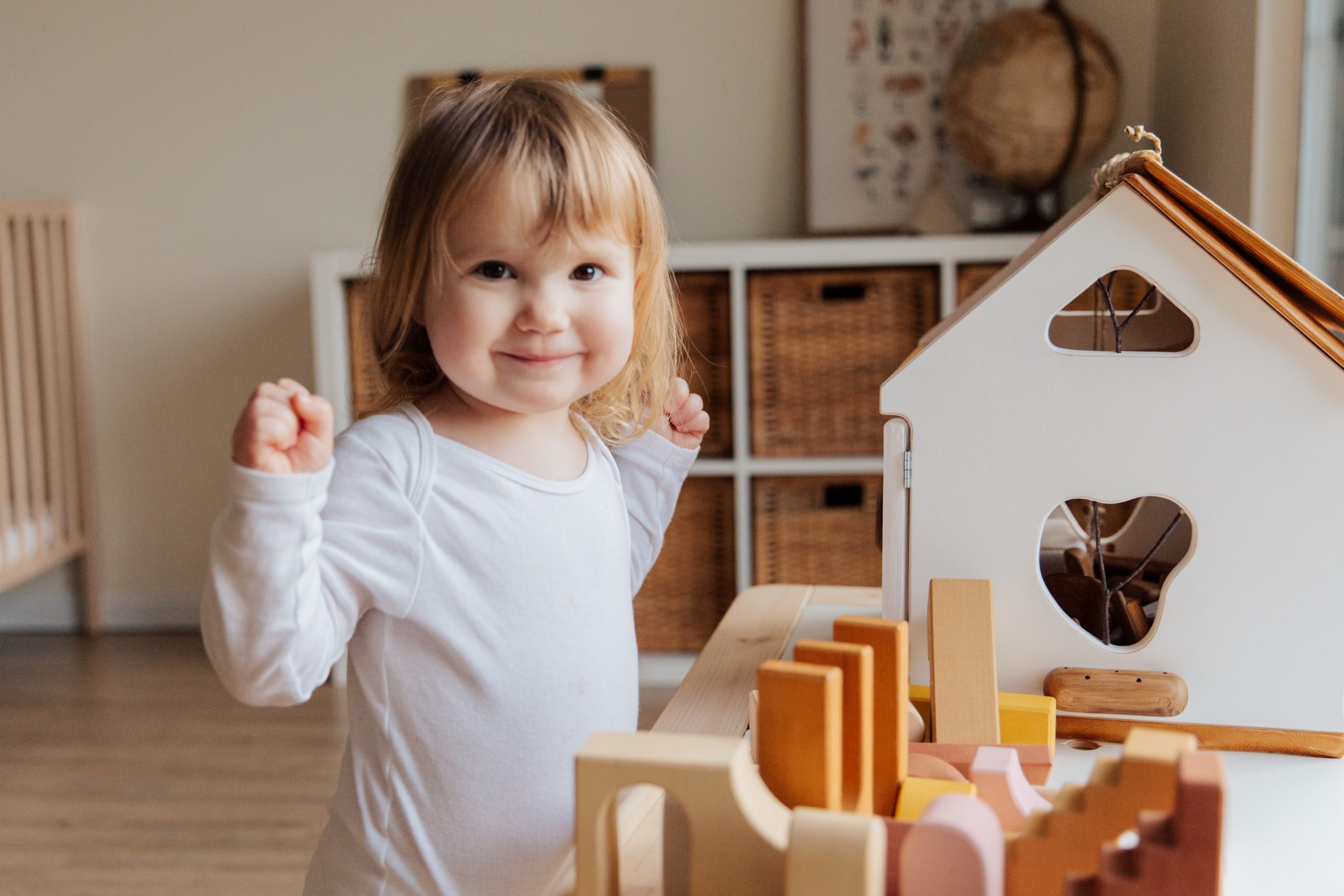 Girl Playing with Dollshouse